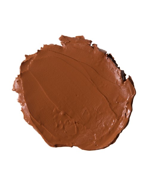 A brown, creamy substance spread on a surface, possibly chocolate or peanut butter.