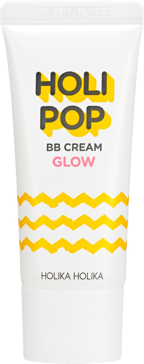 Valkoinen tuubi, jossa keltainen ja musta teksti, aallonharjaisia keltaisia viivoja ja pinkkiä tekstiä, merkitty "HOLI POP BB CREAM GLOW".