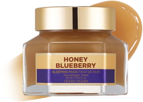 Kannu nimeltä "Honey Blueberry" unta varten, kerma ja violetti etiketti, ja kermatanko vieressä.