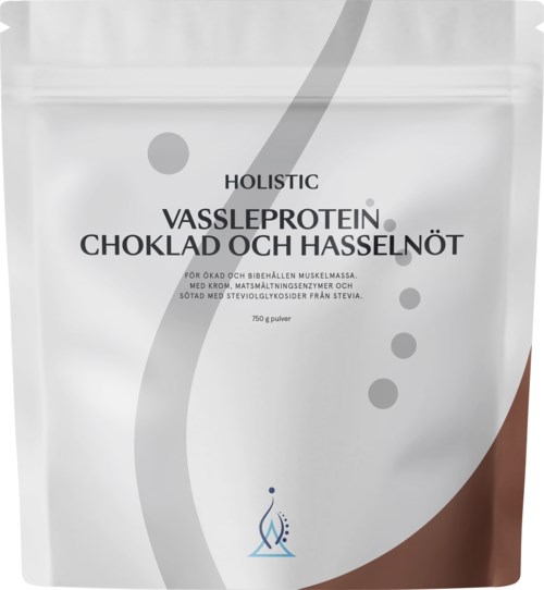 En vit förpackning med grå och bruna design. Text nämner protein, choklad och hasselnötter, samt en vikt på 750 gram.