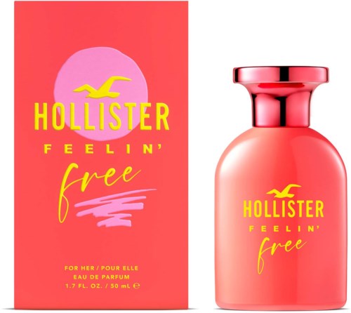 Różowo-żółte opakowanie z buteleczką perfum i pudełkiem, żółty logo ptaka i tekst 'Hollister Feelin' Free'.