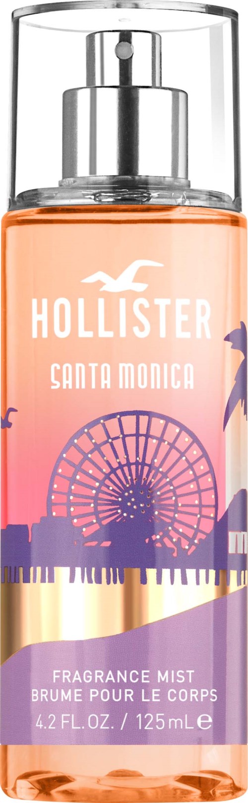 A spray bottle with a pink and purple label, featuring a Ferris wheel and sunset, labeled Hollister Santa Monica.