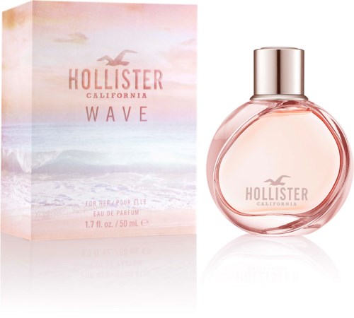 Butelka perfum o nazwie Hollister Wave California obok pudełka z plażowym motywem i różowym niebem.