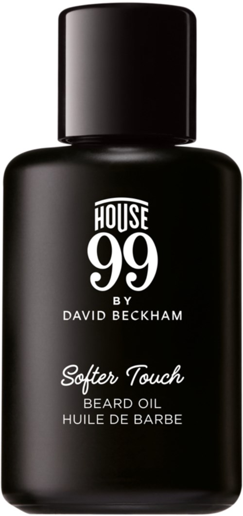 A black bottle of beard oil with white text, labeled 'House 99 by David Beckham' and 'Softer Touch'.