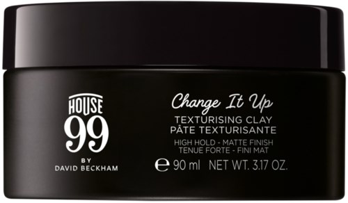 A black jar containing hair styling clay, labeled 'House 99' and 'Change It Up,' 90 ml size.