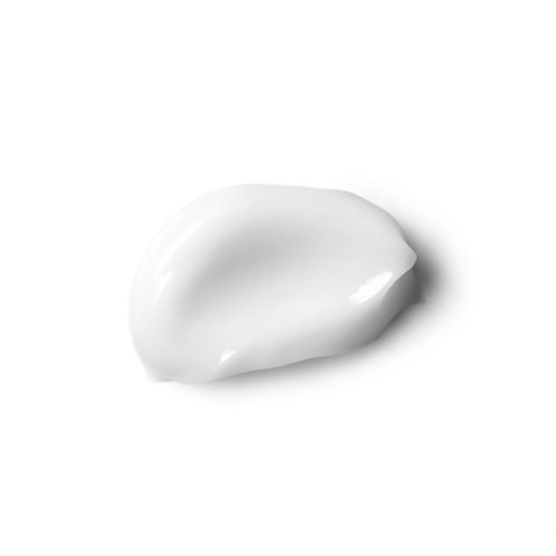 A dollop of white cream or lotion on a white background.
