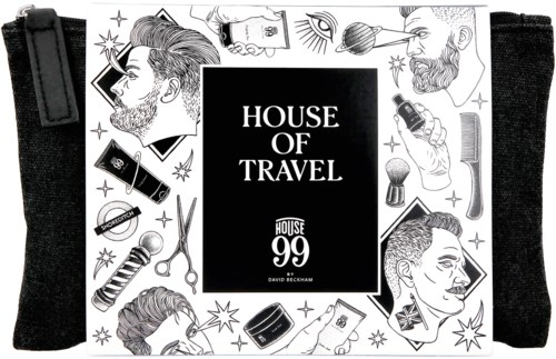 Svartvit väska med människoansikten, stylingartiklar och texten 'House of Travel' i mitten.