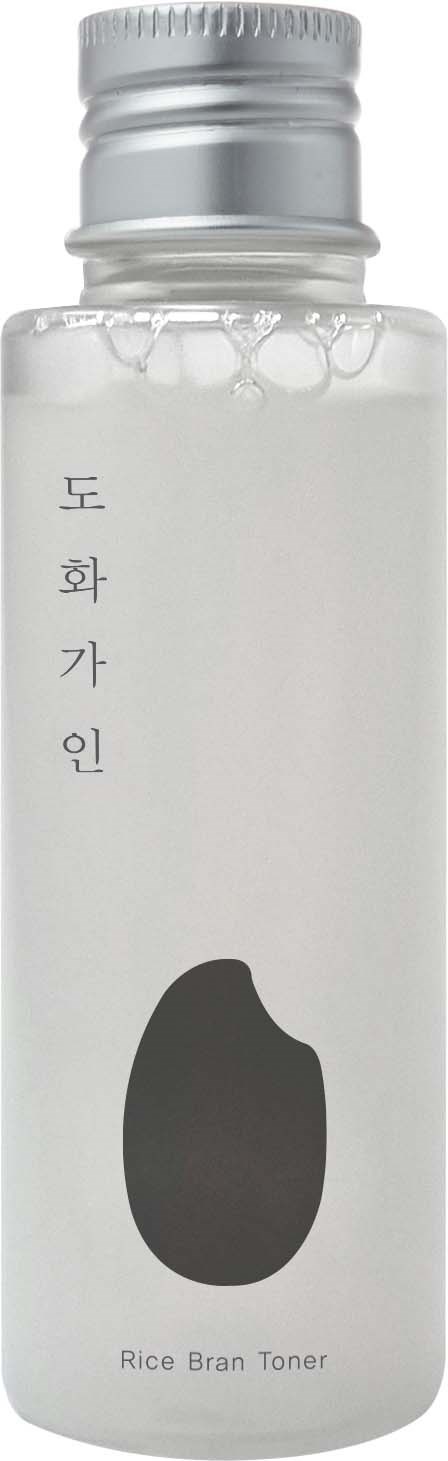 A white bottle labeled 'Rice Bran Toner' with Korean text and a black shape on it.