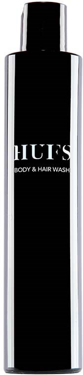 En lang sort og sølvflaske med etiket, der siger 'HUF'S BODY & HAIR WASH', står lodret.