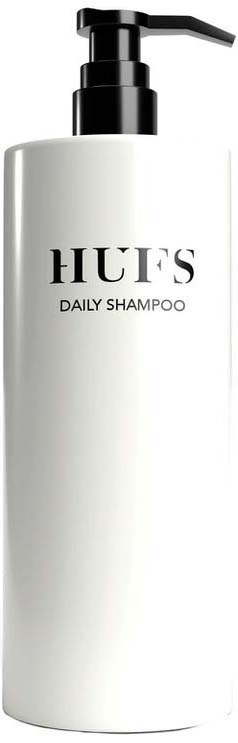Valkoinen pullo HUES Daily Shampoo ja musta annosteluohjain, yksinkertainen etiketti.