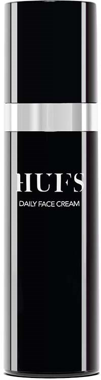 En sort og sølv tube med ordene "HUES DAILY FACE CREAM" på.