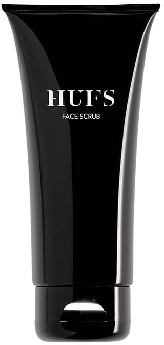 En sort tube mærket 'HUFS FACE SCRUB' med skruelåg, står op.