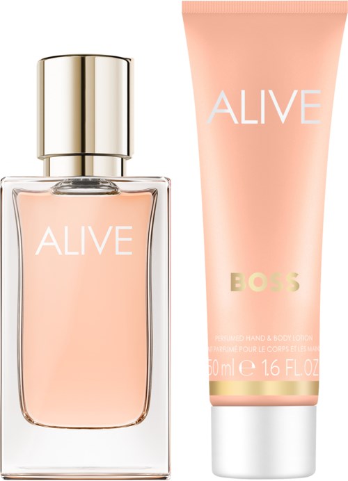 Een parfumfles en een crèmepakje met "ALIVE" label, van BOSS, in zachte roze kleuren.