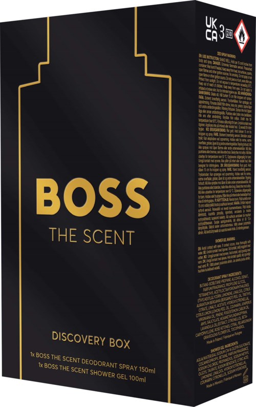 Svart box med guldtext och linjer, märkt BOSS THE SCENT, Discovery Box, med information om dess innehåll.