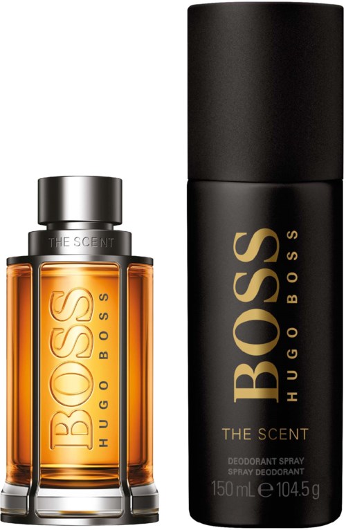En Hugo Boss-parfymflaska och deodorantspray, båda svarta och guld, med varumärket och produktdetaljer.