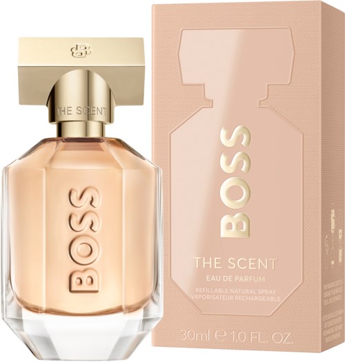 Hajuvesipullo, jossa on beige neste ja vastaava laatikko, merkiltään 'BOSS THE SCENT.'