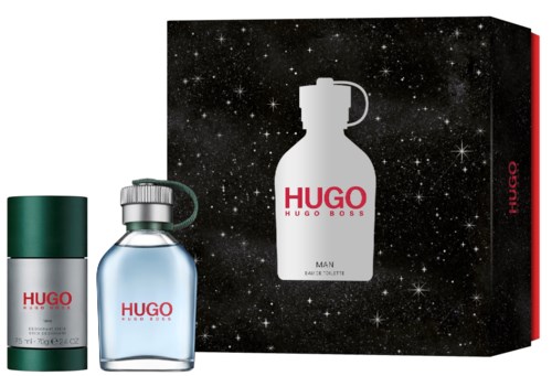 En presentförpackning innehåller en vit flaska, en liten glasflaska och en box med stjärnhimmel och doftillustration.