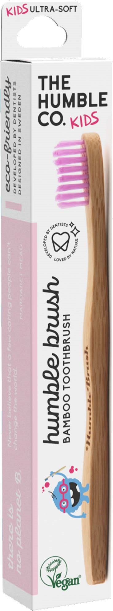 En bambustandbørste i emballage, mærket 'The Humble Co. Kids', med pink børstehår og miljøvenlige symboler.