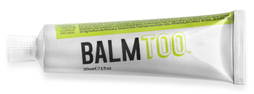 En vit tub märkt 'BALMTOO' i svart och grönt, med en grön rand och liten text, liggande platt.