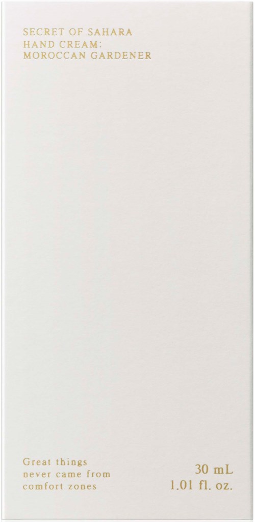 A plain white box with small gold and black text, mentioning Moroccan garden hand cream and comfort zones.