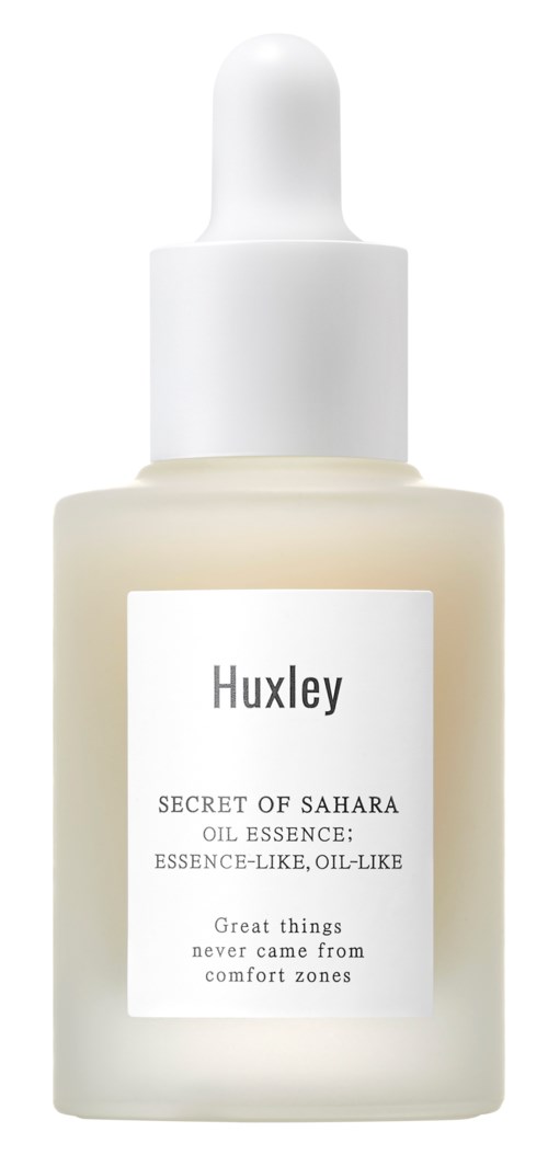 En liten flaska med Huxley Secret of Sahara olja med en vit droppklämma.