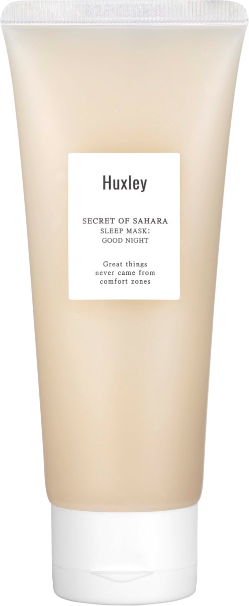 Een beige tube met witte dop, gemerkt 'Huxley' en 'Secret of Sahara Sleep Mask: Good Night'.