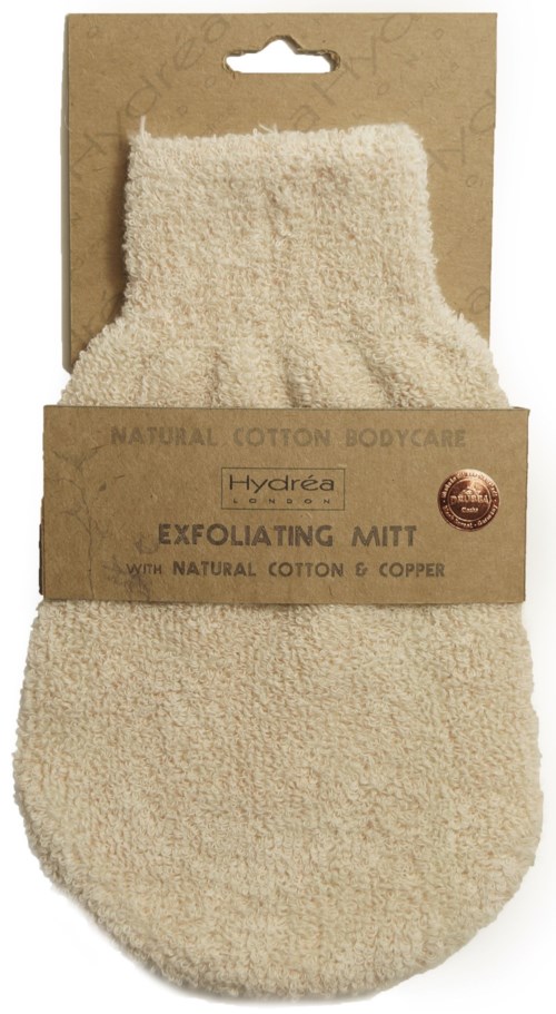 En liten beige exfolierande vante av naturlig bomull och koppar, fäst vid brun förpackning.