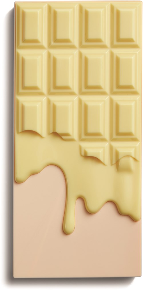 A white chocolate bar with a bite taken out of the bottom left corner, showing creamy inside.