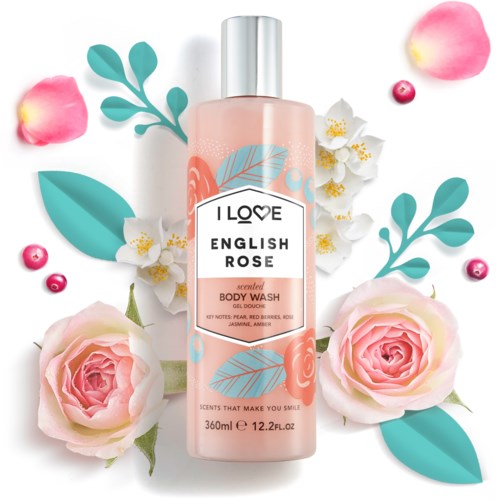A pink body wash bottle with floral illustrations, surrounded by roses, petals, and green leaves.
