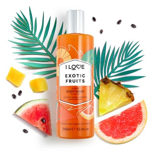 Orange body wash with pineapple, watermelon, and grapefruit slices, tropical leaves, and black seeds.
