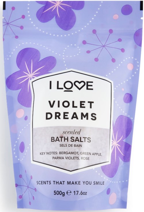Lila blommig bakgrund med etikett; badsalt doftande av bergamot, grönt äpple, violer och ros.