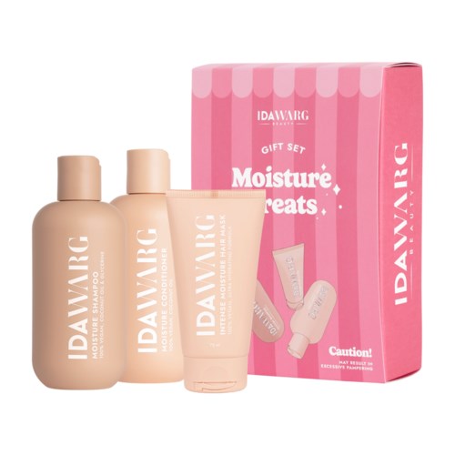 IDAWARK Moisture Treats lahjapakkaus shampoonilla, hoitoaineella ja voiteella pinkin pakkauksen edessä.