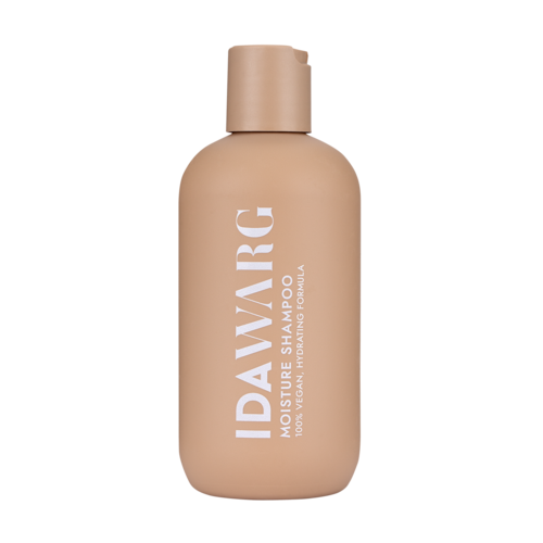 Beige flaska märkt 'IDAVARIC MOISTURE SHAMPOO' för hår, med ett enkelt lock.