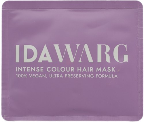 Lila förpackning för en hårinpackning med fet vit text, noterar att den är vegansk och ultra-bevarande.