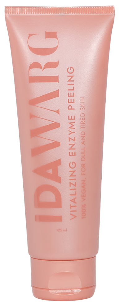 Różowa tubka produktu do skóry z pomarańczowym tekstem, oznaczona 'IDAWARC' i 'Vitalizing Enzyme Peeling'.