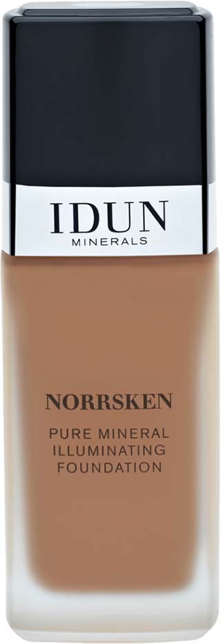 En beige foundationflaske med svart fast, merket 'IDUN Minerals' og 'Norsken', står oppreist.
