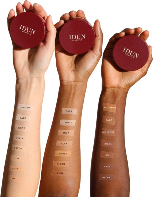 Drie armen met verschillende huidtinten en een rode compact met 'IDUN'-logo.