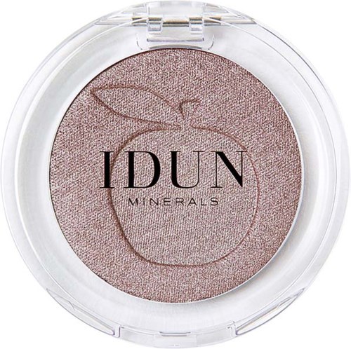 A round makeup compact with a pink, shimmery powder inside, labeled 'IDUN MINERALS' with a leaf and fruit design.