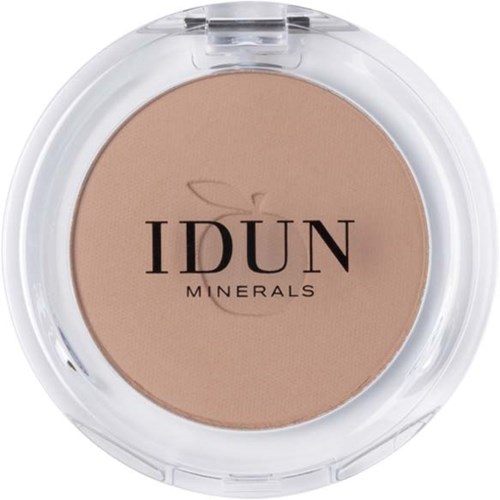 En kompakt av IDUN Minerals presset pulver, lys beige farge, klar plastlokk, merkets navn i svart tekst.