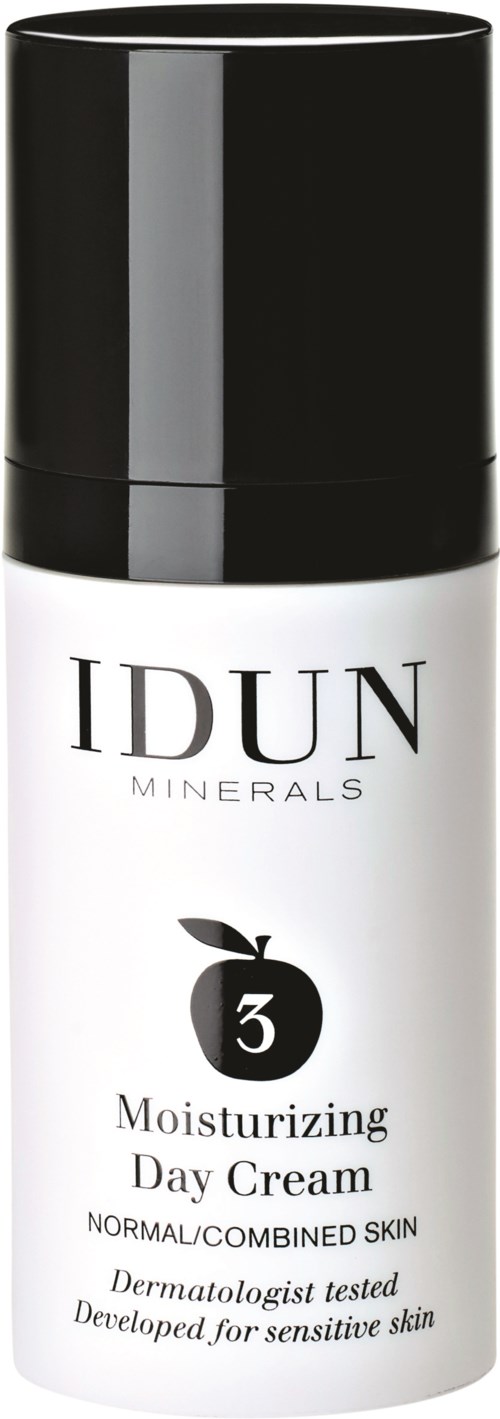 En vit flaska med svart lock, märkt IDUN Minerals, fuktighetskräm för dag för känslig, normal eller blandad hud.