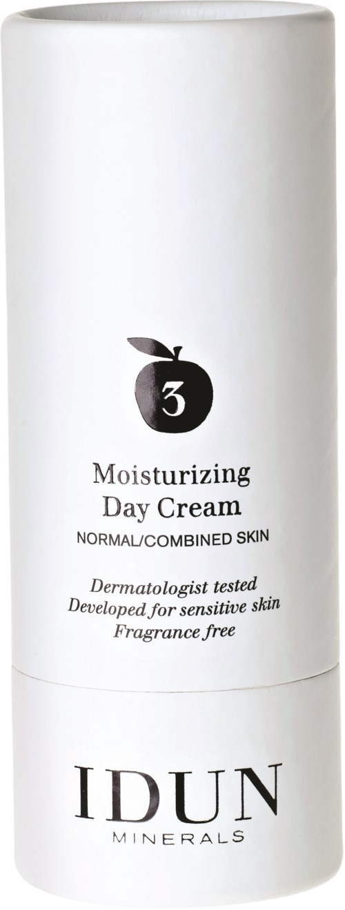En vit flaska märkt 'Moisturizing Day Cream' för känslig hud, parfymfri, utvecklad av dermatologer, från IDUN Minerals.