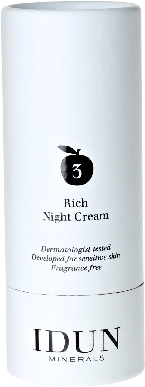 En hvit sylinderformet beholder merket 'IDUN Minerals Rich Night Cream' med en svart eplesymbol og produktdetaljer.