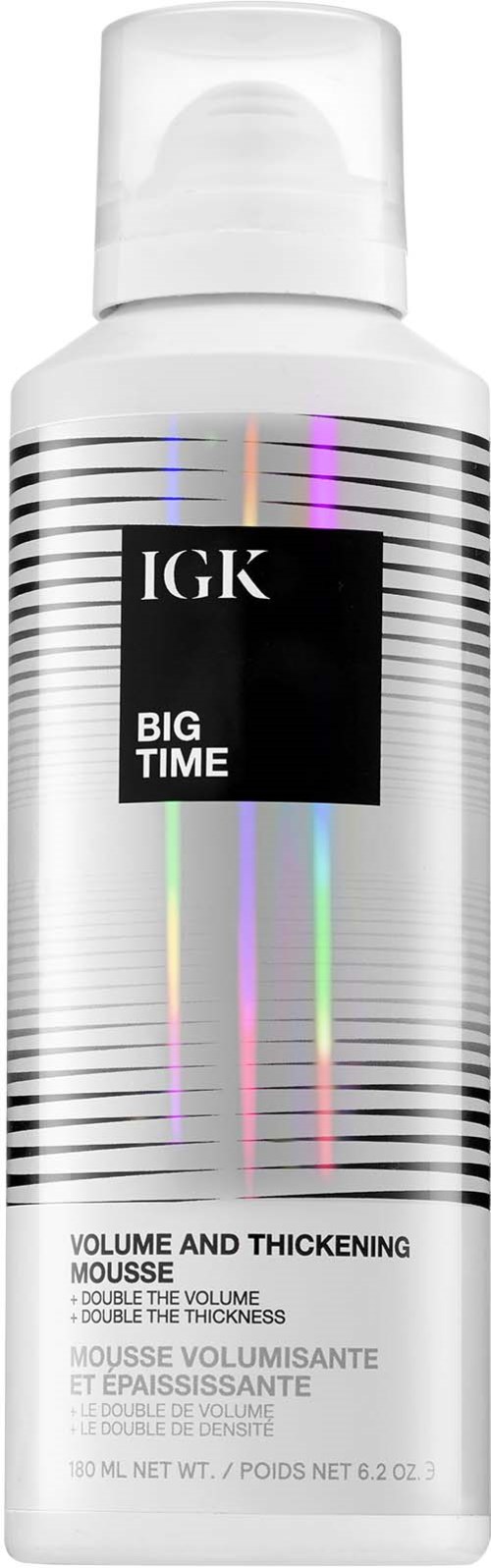 En hvit flaske med IGK Big Time volum- og tykkelsesmousse med fargede holografiske linjer.