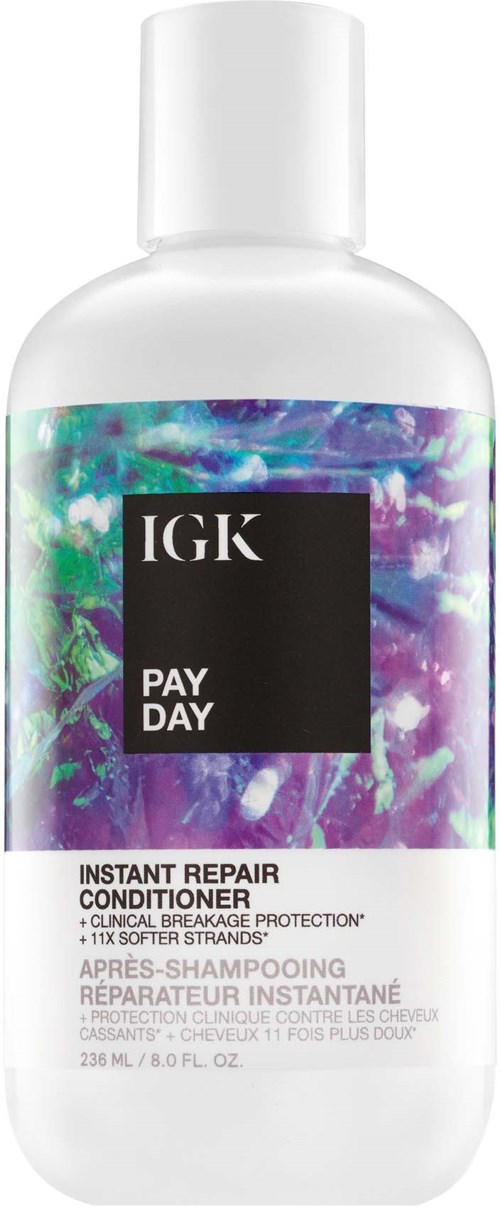 Valkoinen pullo, jossa on värikäs hologrammainen suunnittelu ja musta tarra, jossa lukee 'IGK PAY DAY' ja 'Instant Repair Conditioner.'