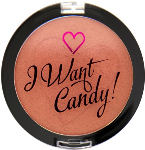 En sminkrougeskumsbehållare med en rosa hjärtan och texten "I Want Candy!" på sig.