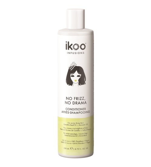 A white bottle of conditioner with a girl with black hair illustration, used for hair care, avoiding frizz and drama.