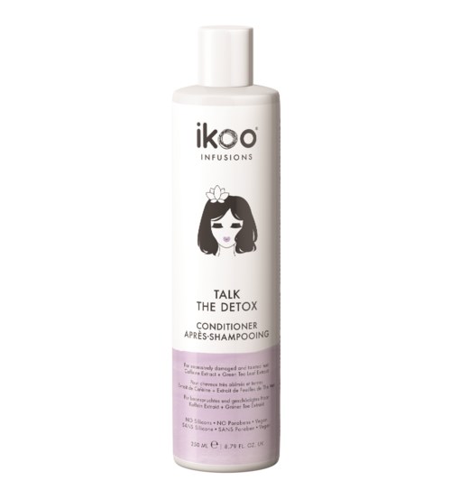 En hvit flaske med iko infusions balsam som heter Talk the Detox, med en jente-illustrasjon og lilla etikett.