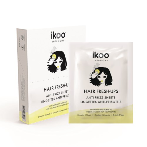 A box and a packet of hair care sheets with a woman's face and a yellow towel on her hair.