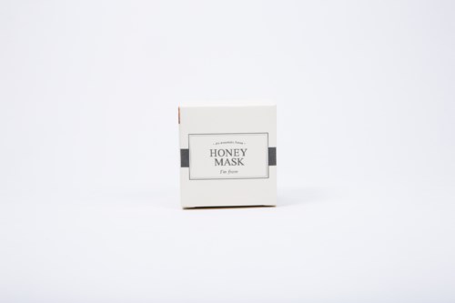 A small box labeled 'Honey Mask' with a simple design, placed on a white background.