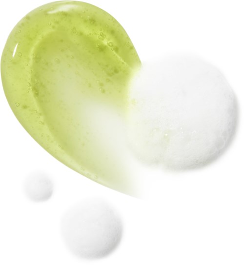 Green and white gelatin-like blobs with a smooth texture, some small bubbles on the surface.